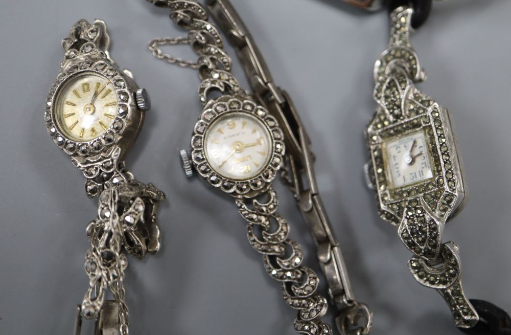 Three ladys assorted silver cocktail wrist watches and a sterling watch.
